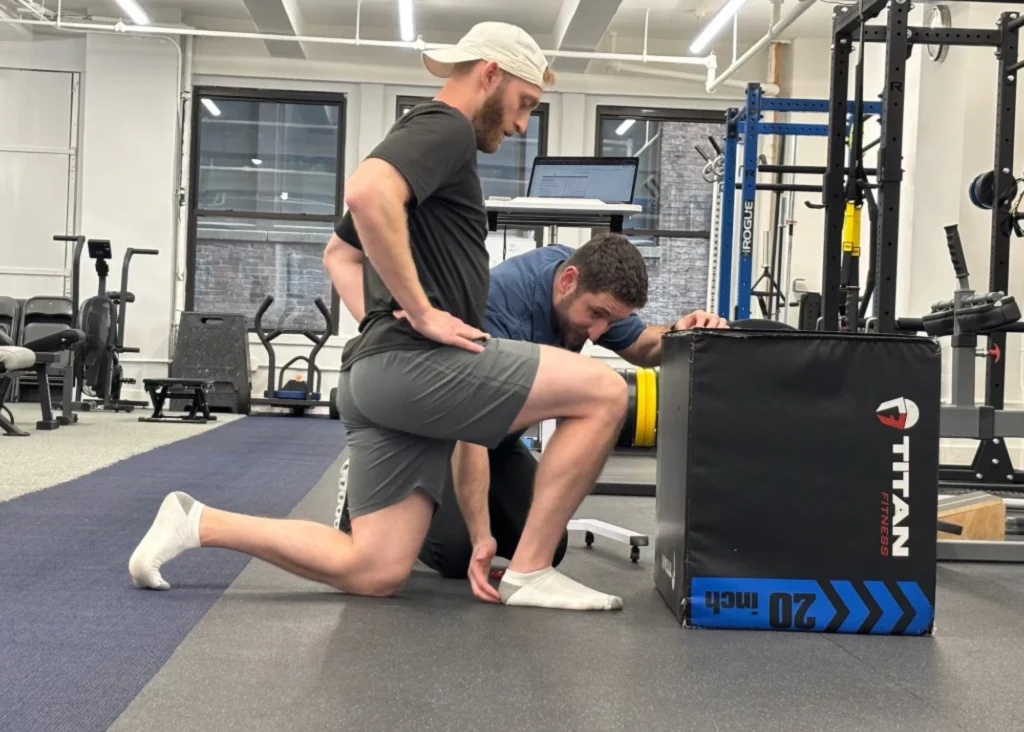 Trainer Doing Athletic Assessment