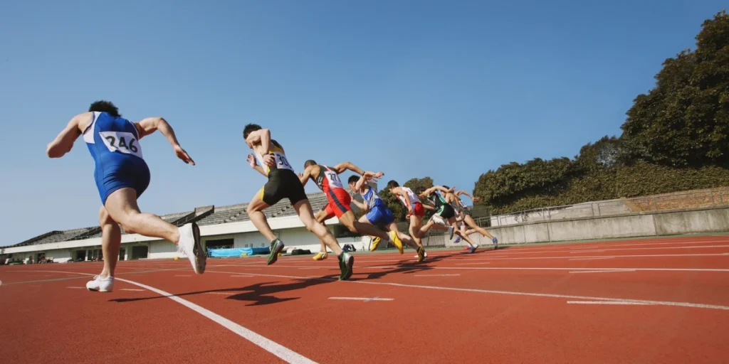 Athletes running on track